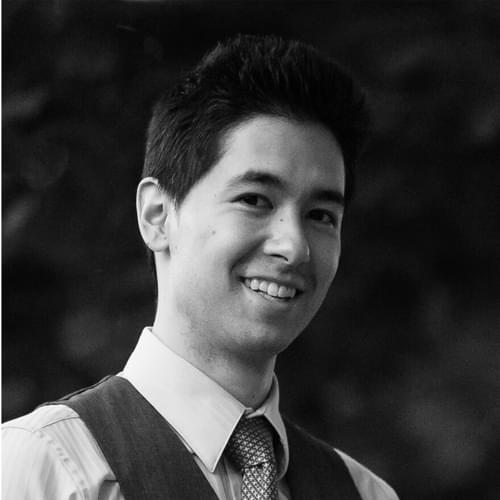 Headshot of Matt Cheng. He smiles and wears a collared white shirt, tie, and vest.